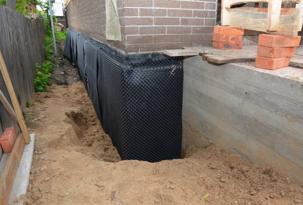 Happy homeowners after waterproofing job in Bean Station